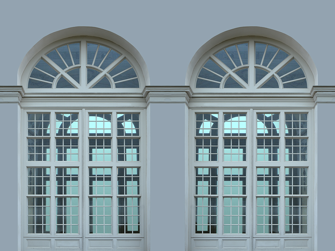 Trompe l'oeil architecture wallpaper with large arched glass windows on an off-white background