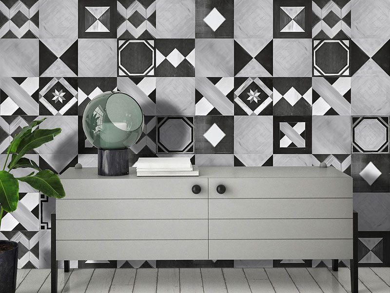 Geometric wallpaper with black and white hand-painted cement tiles, in a living room