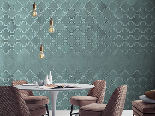 Green wallpaper with an oriental geometric design, which covers a classic living room