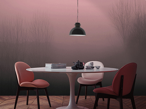 Dining room coverede with a landscape themed wallpaper with trees shrouded in fog