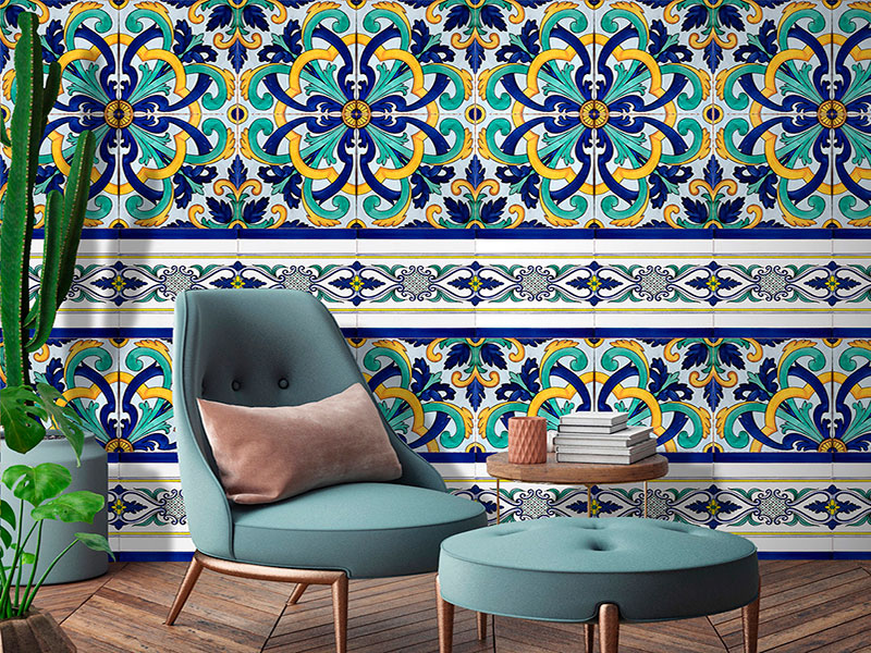Wallpaper with majolica with floral texture in blue, green and yellow colors on a white background, in a living room