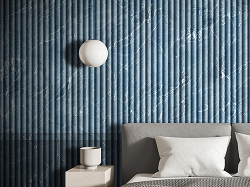 Wallpaper with vertical marble slat boiserie in shades of blue, which adorns a bedroom