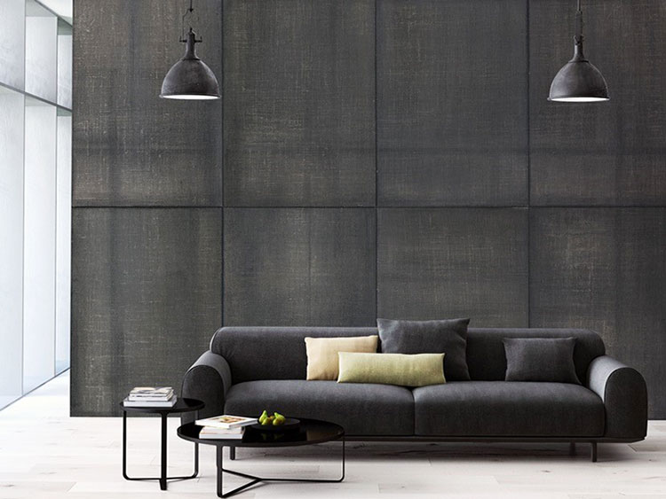 Modern living room furnishes with a wallpaper with fabric panels textured in grey tones