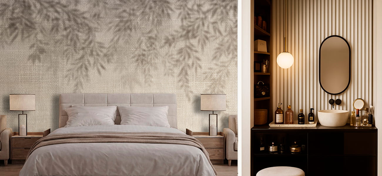 Carta da parati con effetto ombra di foglie e finiture materiche eleganti in una camera da letto e un bagno moderno.