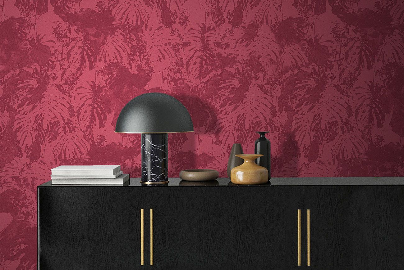 Wallpaper in shades of red with texture of tropical leaves, fabric effect, in a living room