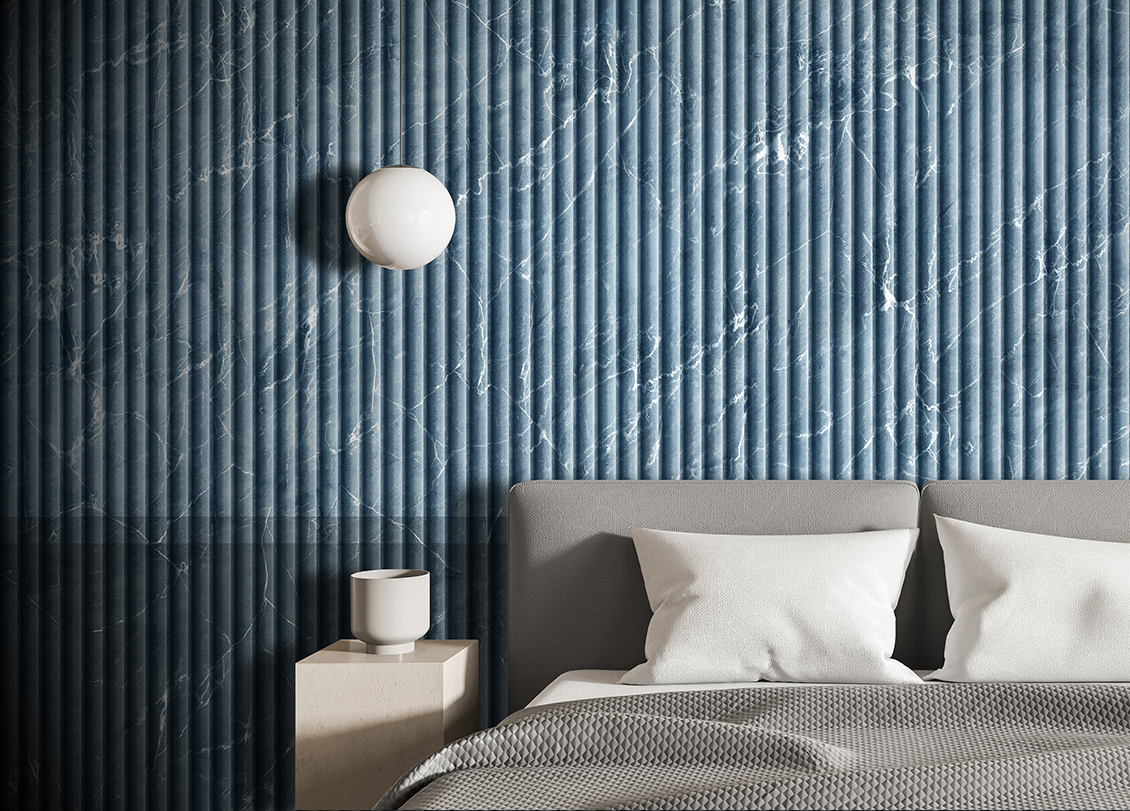 3D wallpaper with boiserie with vertical marble-effect strips in various shades of blue which adorns a bedroom