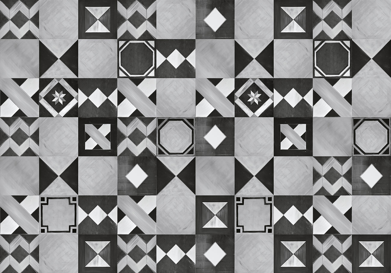 Carta da parati con piastrelle dai decori geometrici di colore bianco nero e grigio